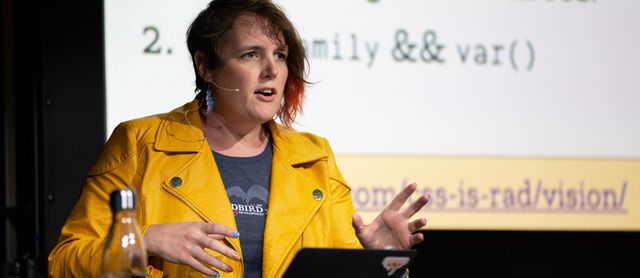 Miriam Suzanne speaking at a conference